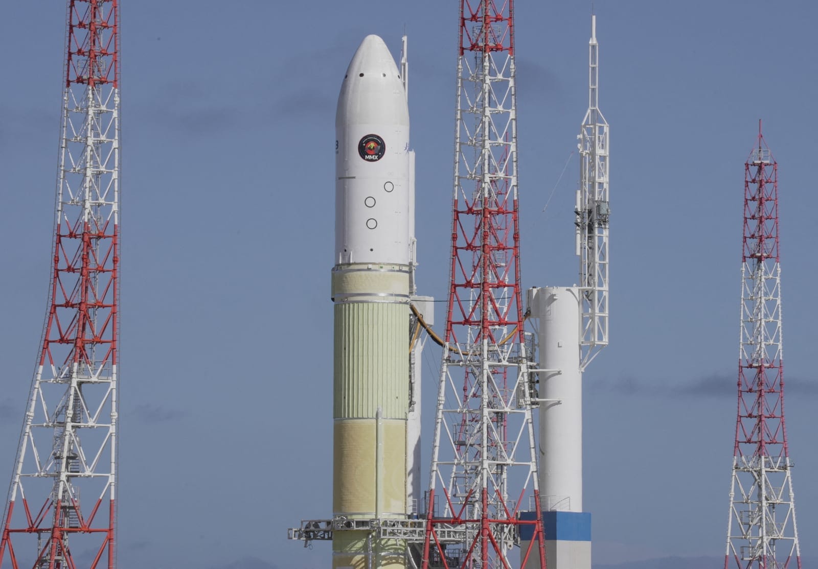 The H3 rocket carrying the Martian Moons Exploration (MMX) rover bound for Mars' moon Phobos rolls out to the launchpad ahead of its expected launch at Tanegashima Space Center on the southwestern island of Tanegashima, Kagoshima Prefecture, southwes