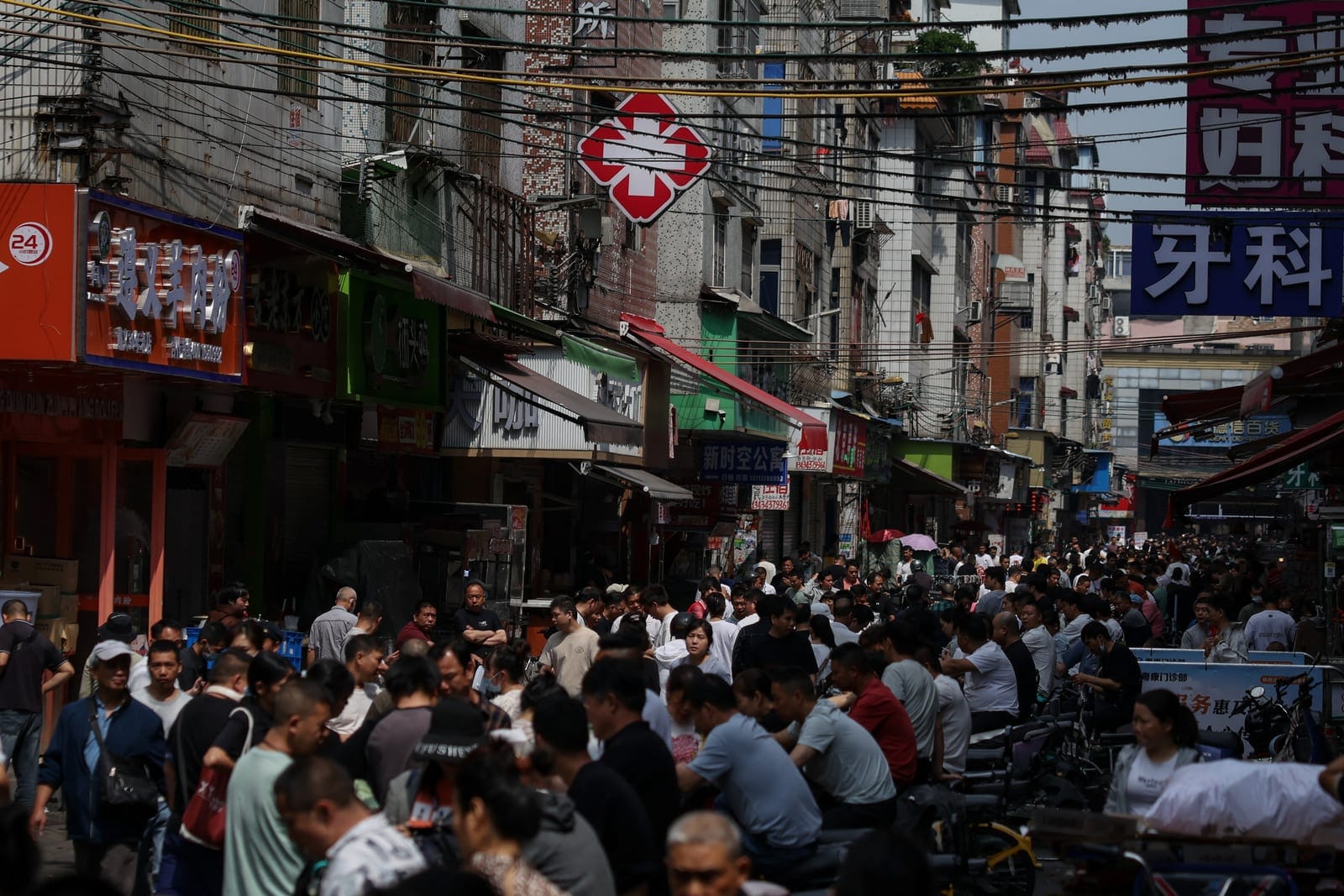 Recruiters and workers gather at a labour market in an urban village in Guangzhou, Guangdong province, China March 17, 2026. REUTERS/Tingshu Wang