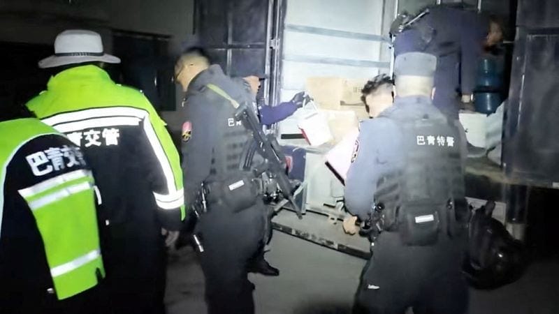 Emergency services personnel place items retrieved from a building into a vehicle, following an earthquake, at a location given as Nagqu, Tibet Autonomous Region, China in this still image from video released October 23, 2026. Nagqu Police Department