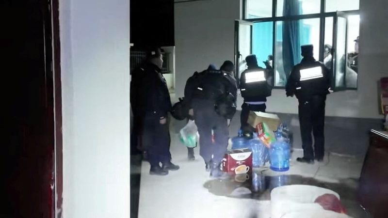 Emergency services personnel retrieve items from a building following an earthquake, at a location given as Nagqu, Tibet Autonomous Region, China in this still image from video released October 23, 2026. Nagqu Police Department/Handout via REUTERS RE