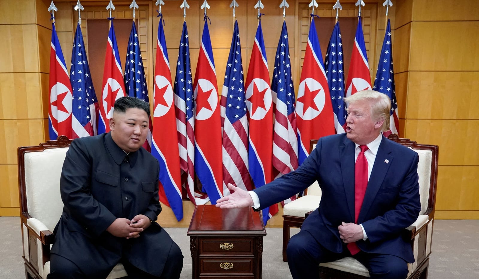 FILE PHOTO: U.S. President Donald Trump meets with North Korean leader Kim Jong Un at the demilitarized zone separating the two Koreas, in Panmunjom, South Korea, June 30, 2019. REUTERS/Kevin Lamarque/File Photo