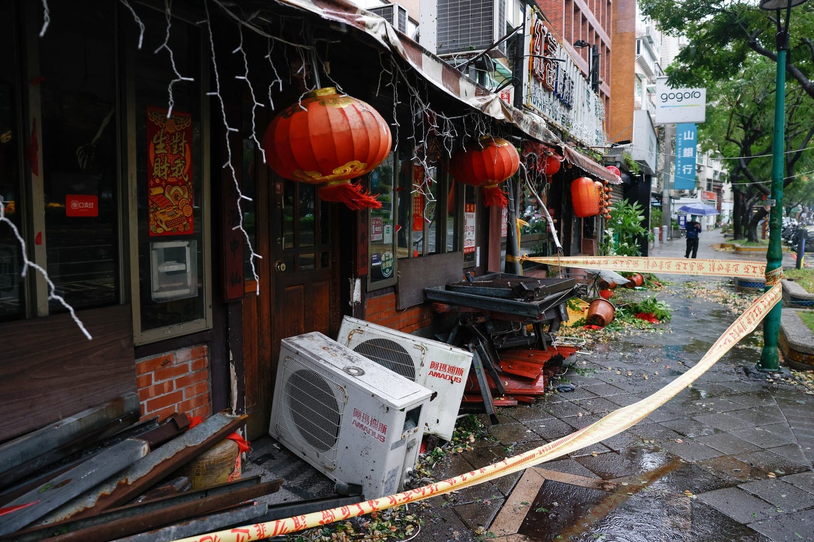 Debris lies outside a damaged restaurant after strong winds brought by Typhoon Champi, in Taipei, Taiwan October 24, 2026. REUTERS/Ann Wang