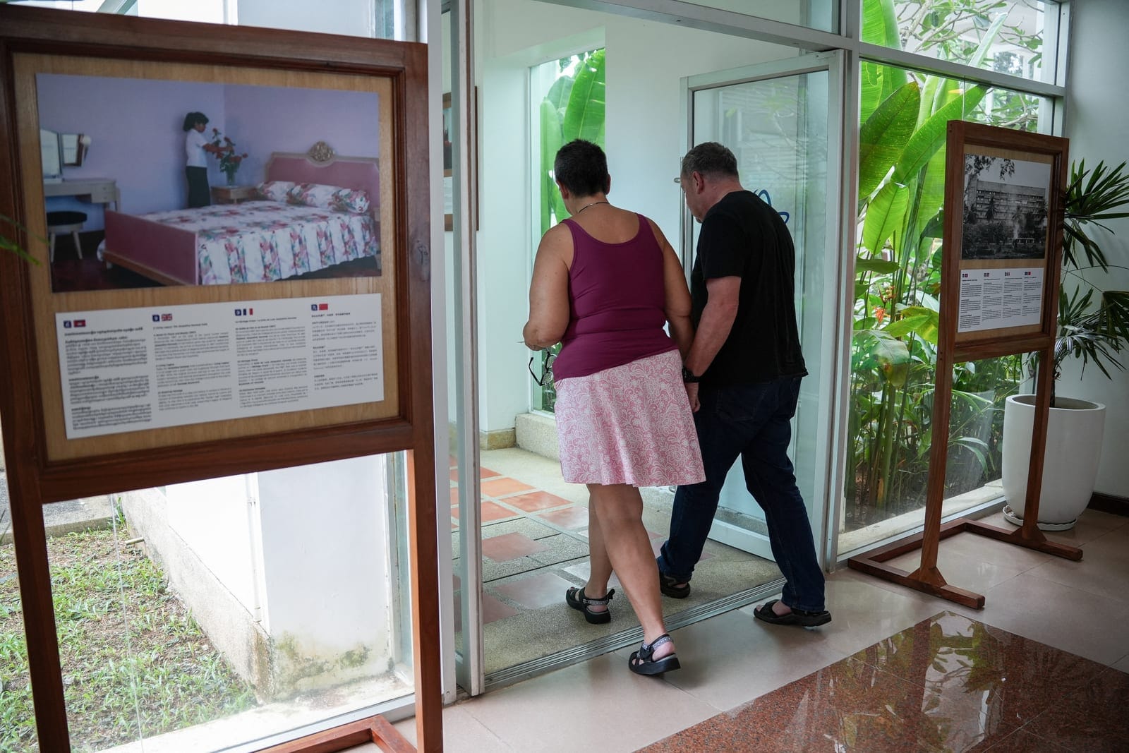 American couple Paul Montaya, 68, and Lynn Montaya, 64, from Colorado, U.S., who hoped to travel the world together while living aboard the Villa Vie Odyssey cruise ship, walk out the hotel during an interview with Reuters after being forced to disem