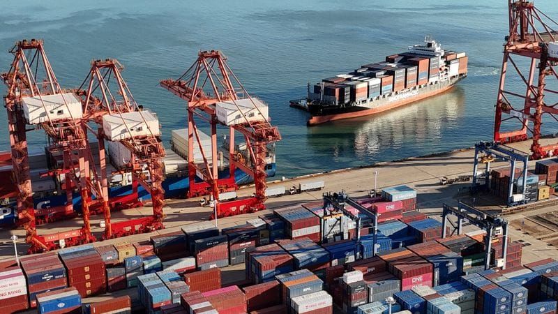 Drone view shows a cargo ship approaching a container terminal at Lianyungang port