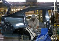 An employee works at an assembly line in AutoAlliance Thailand, a Ford and Mazda joint venture plant, located in Rayong province