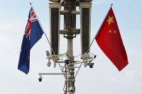 Flags of New Zealand and China flutter in Beijing