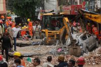 Search for survivors following building collapse in New Delhi