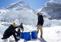 FILE PHOTO: People collect water from a glacier at Everest base camp