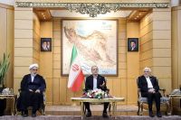 Iranian President Masoud Pezeshkian speaks before departing for New York, at Mehrabad Airport in Tehran