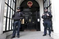 Policemen stand guard outside the Chinese Embassy in London, Britain