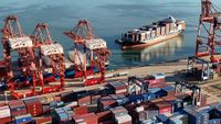 Drone view shows a cargo ship approaching a container terminal at Lianyungang port