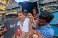 Bollywood actor Imran Khan is detained by security personnel during a protest by the Cockroach Janta Party (CJP) seeking the resignation of India's Chief Election Commissioner Gyanesh Kumar,