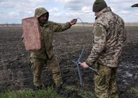 FILE PHOTO: Ukrainian servicemen set up Starlink satellite internet system near the frontline town of Pokrovsk