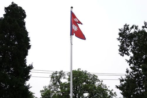 National flag of Nepal flutters at the Embassy of Nepal, in Beijing