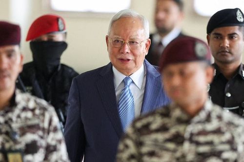 Malaysia's former Prime Minister Najib Razak arrives at the Kuala Lumpur High Court for a hearing on his bid to stay the execution of a 15-year jail sentence imposed in a case linked to the
