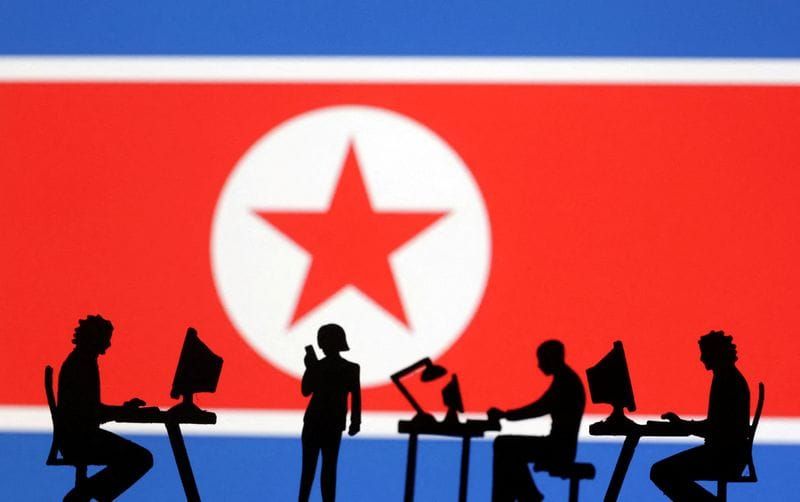 FILE PHOTO: Illustration shows miniatures and North Korea flag