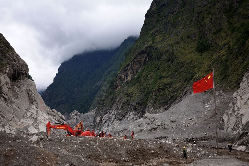 Rescue workers conduct search and rescue operations at the core disaster-hit area at Gyirong Port in Shigatse, Tibet