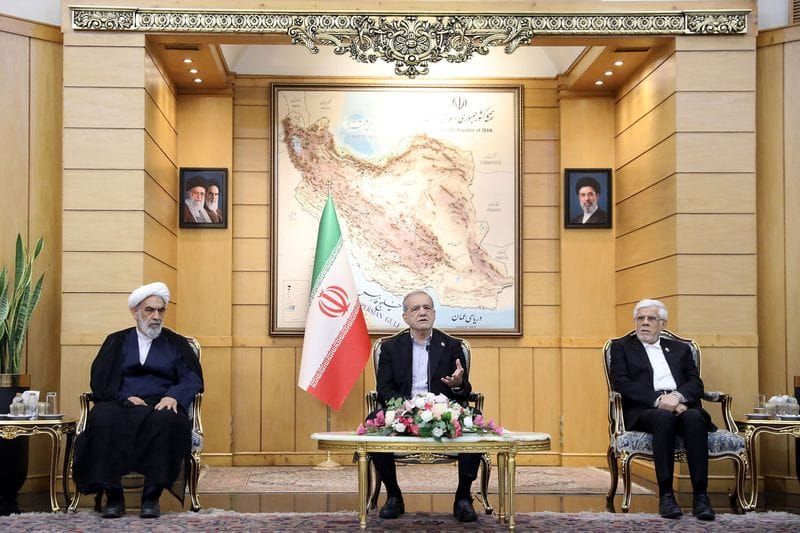 Iranian President Masoud Pezeshkian speaks before departing for New York, at Mehrabad Airport in Tehran