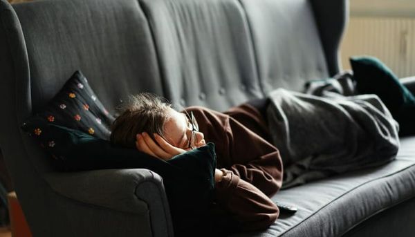 sleeping person on sofa