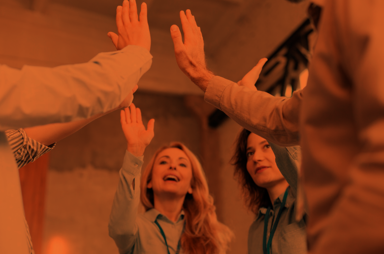Team at work doing high five