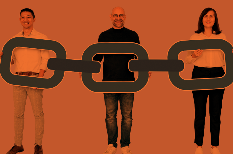 Three people making a people chain. 