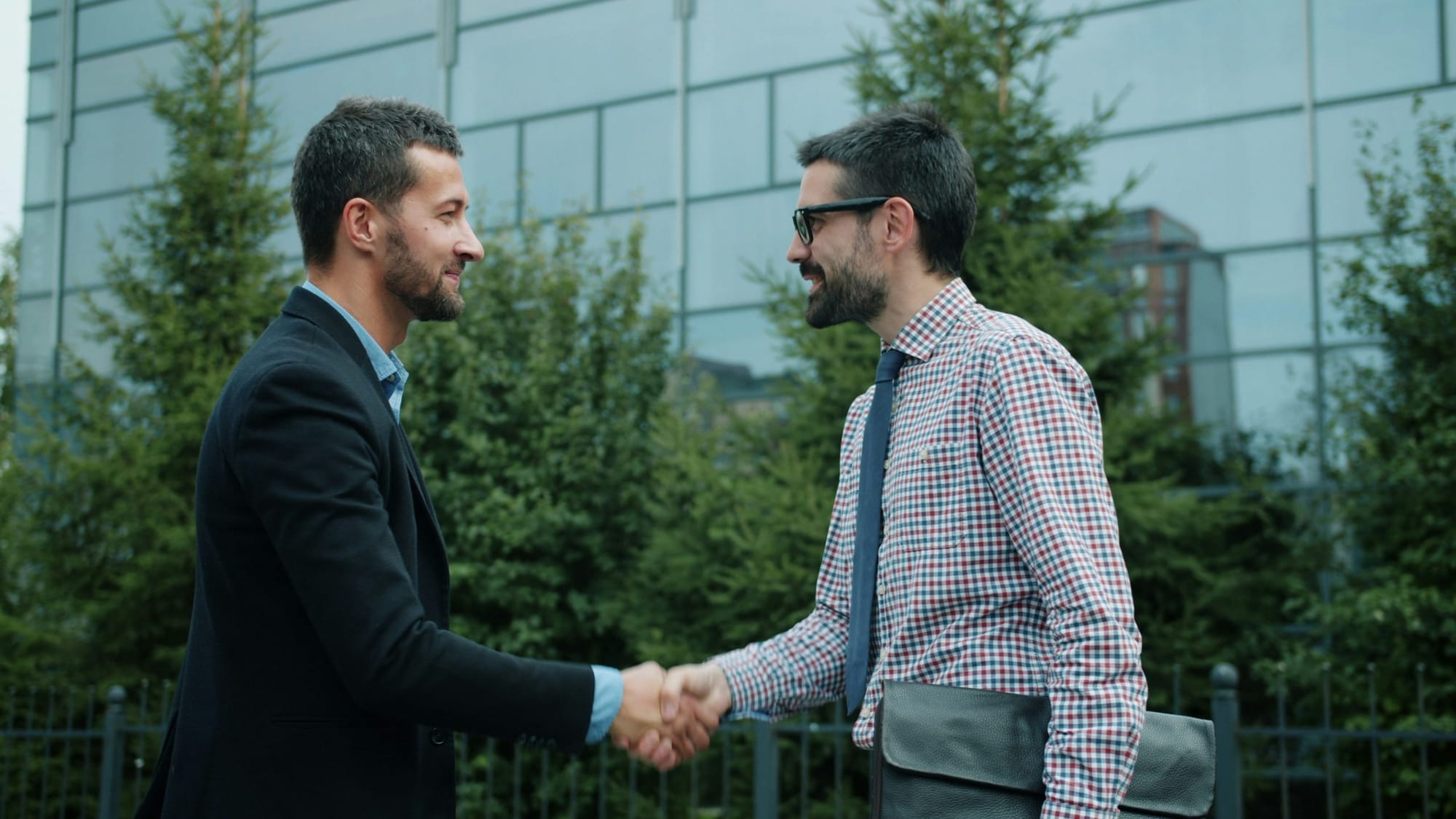Two professionals shaking hands over a recruitment deal. 