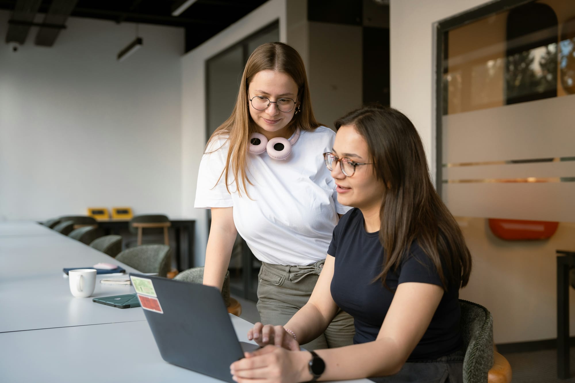 Gen Z employees at work on a laptop.