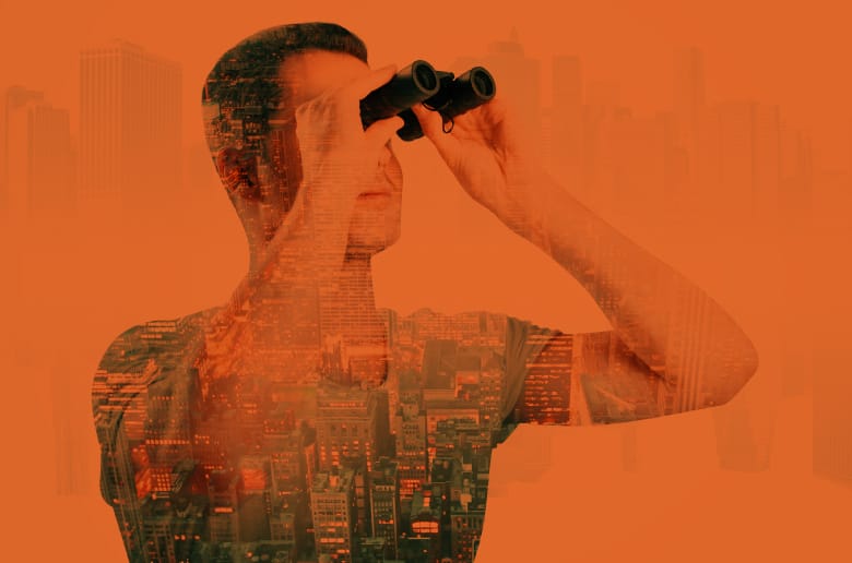 Guy looking at the future with binoculars 