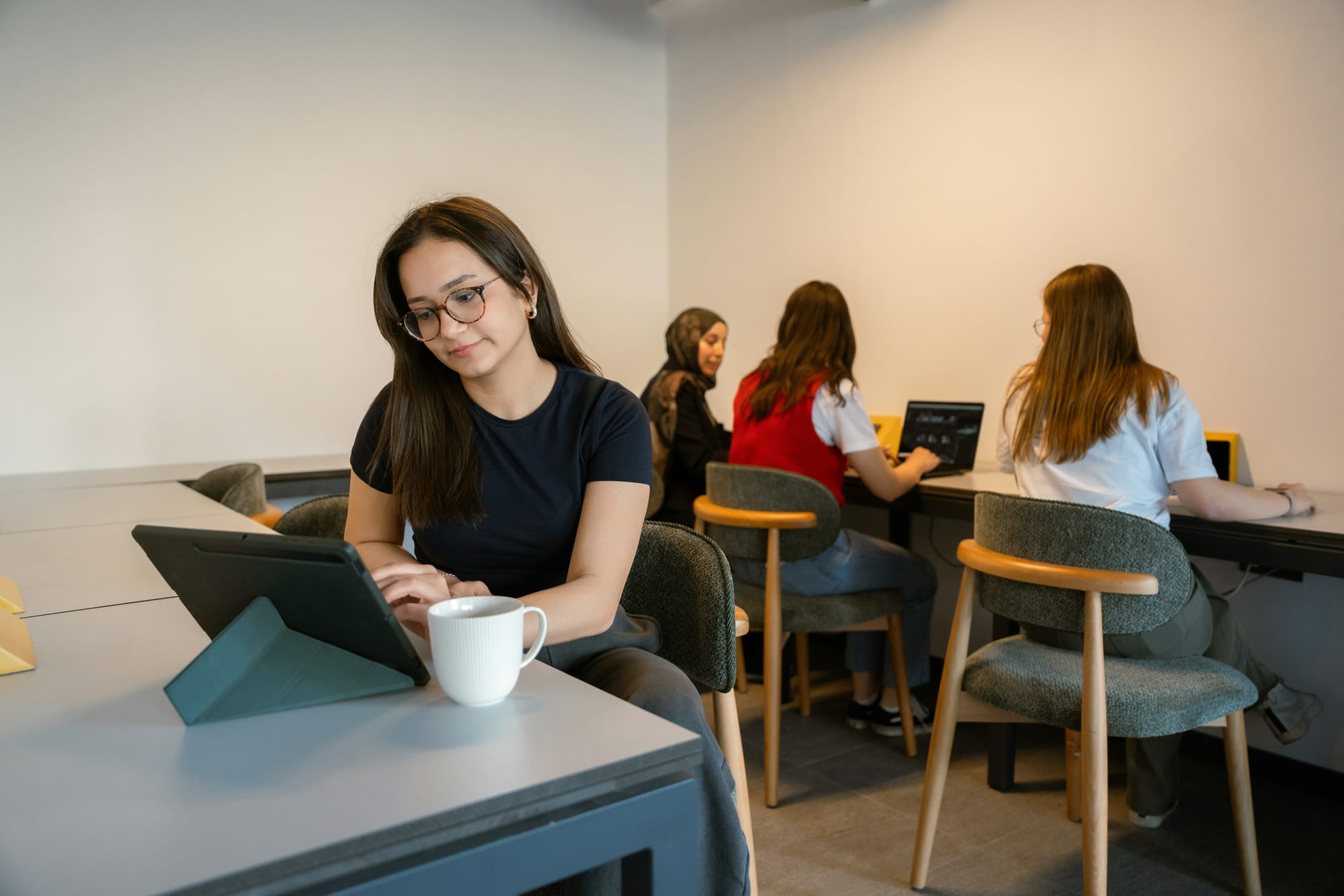 Young professionals working in a modern office, representing Gen Z candidates entering the workforce.
