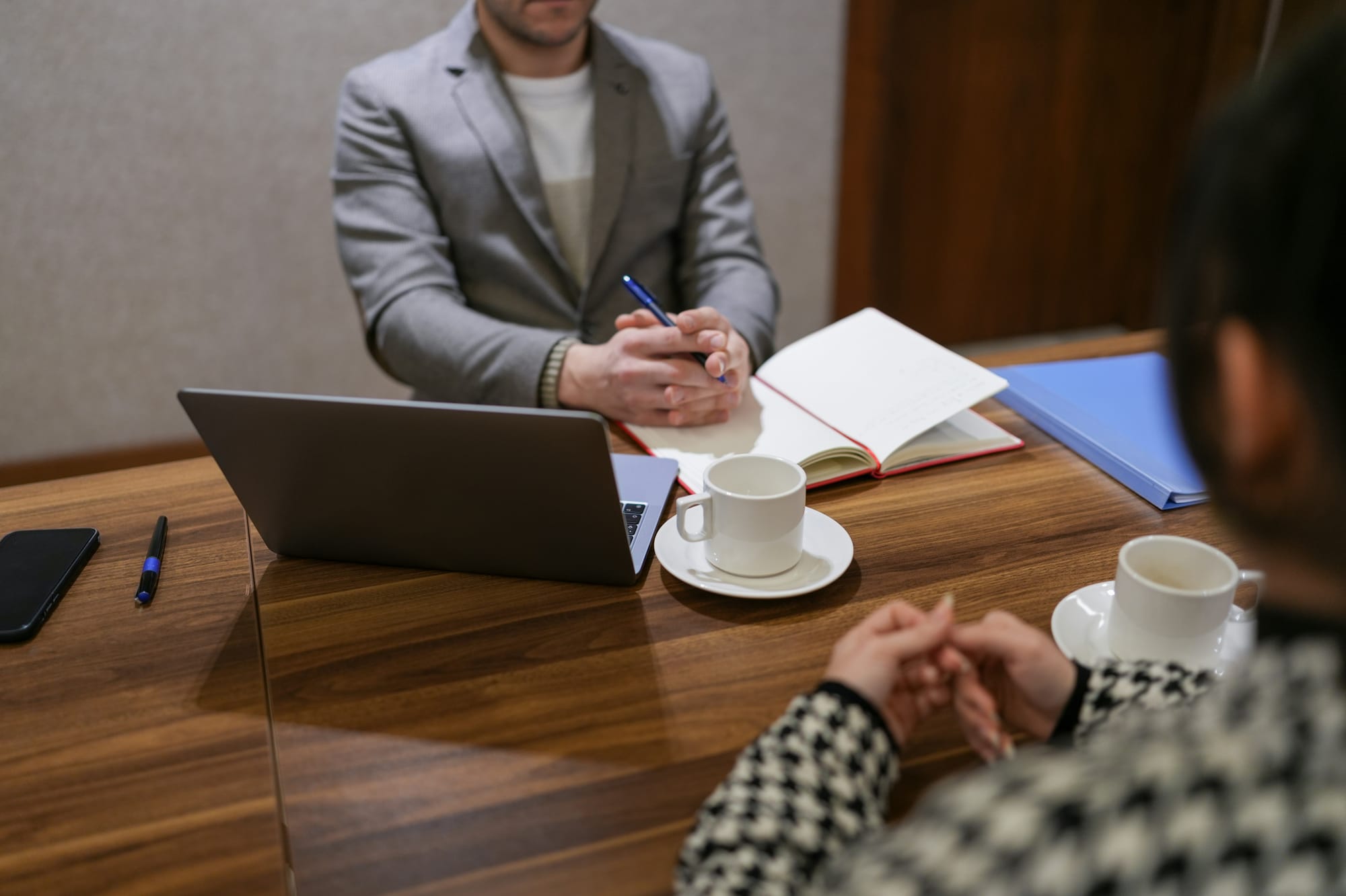 Hiring manager interviewing a candidate, representing new job opportunities during the September Surge.