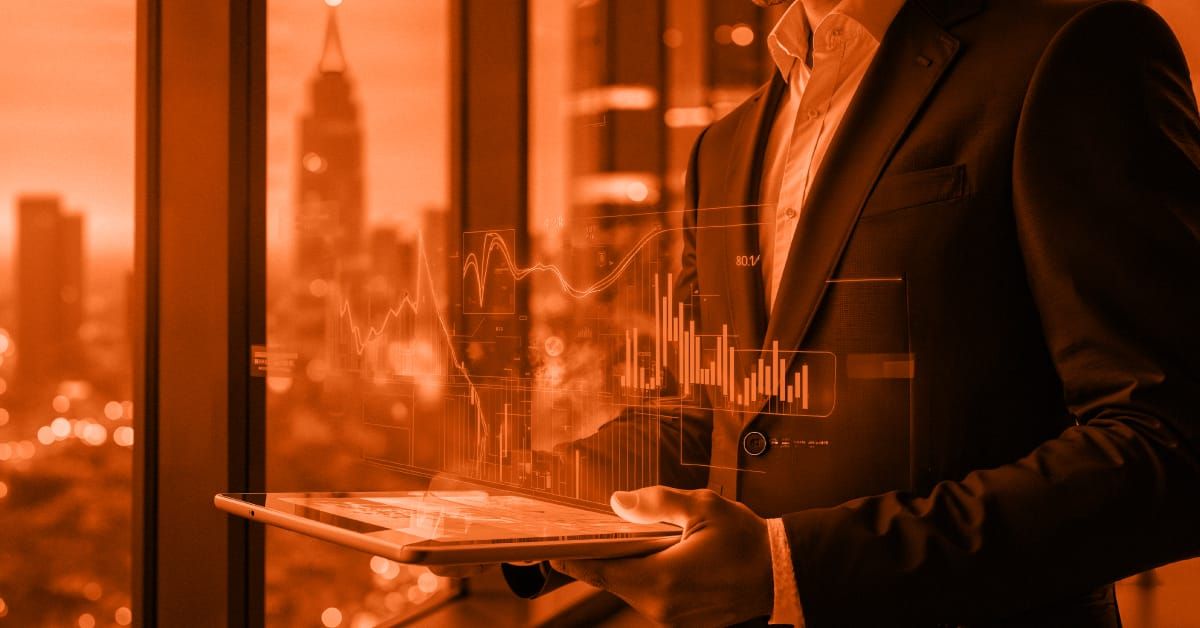 Professional at workplace holding an ipad with financial diagram