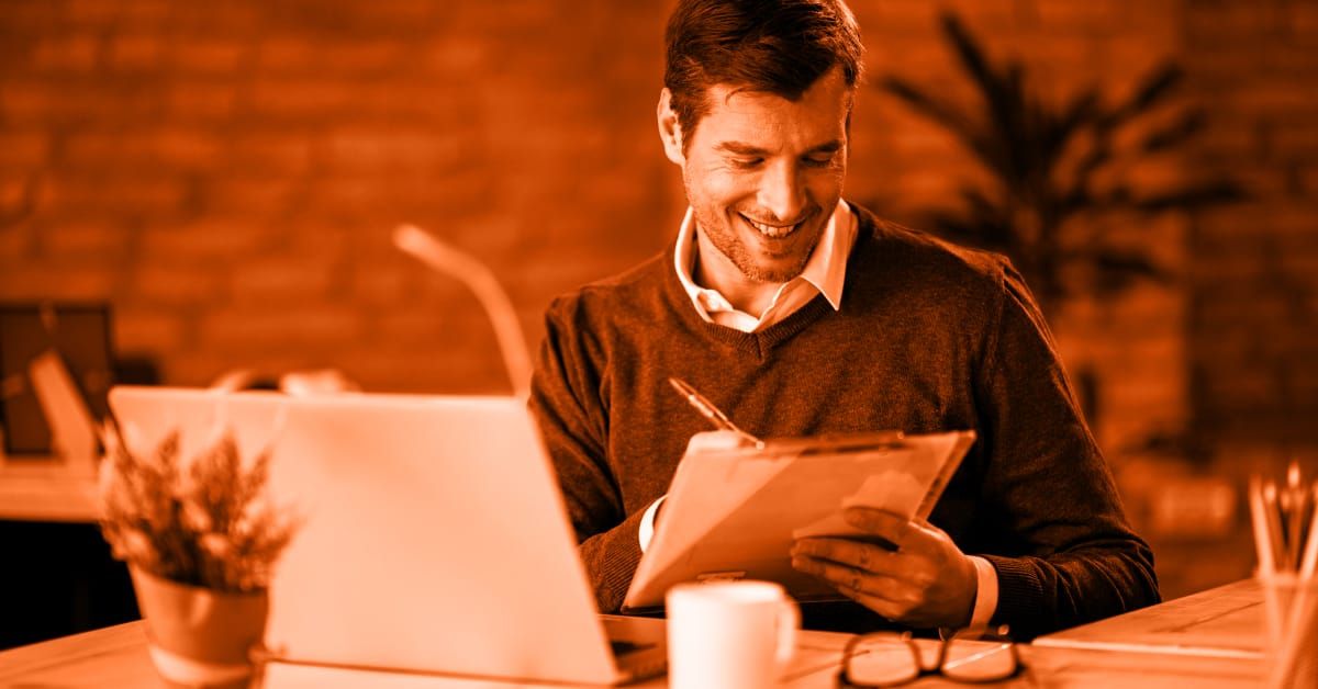 Office assistant writing on a piece of paper