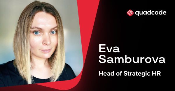 Quadcode team in corporate setting discussing careers and jobs in Cyprus