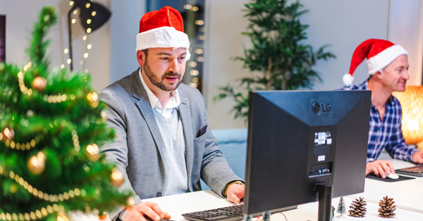 Employees working in an office during the holiday season, representing the job market during festive periods