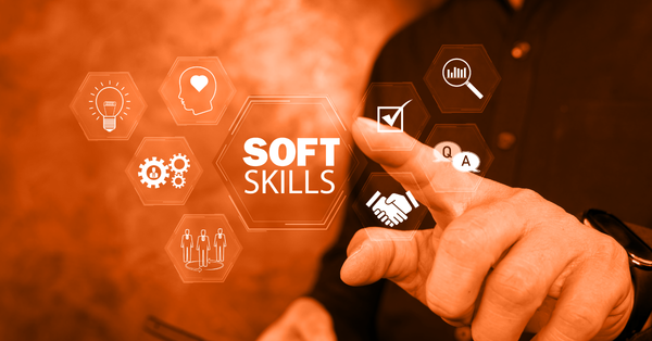 Banner with icons and a text "Soft Skills" with a hand pointing at it. 