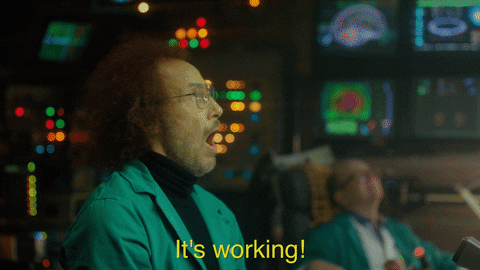 A GIF with a man shouting "It's working!" in a control room.