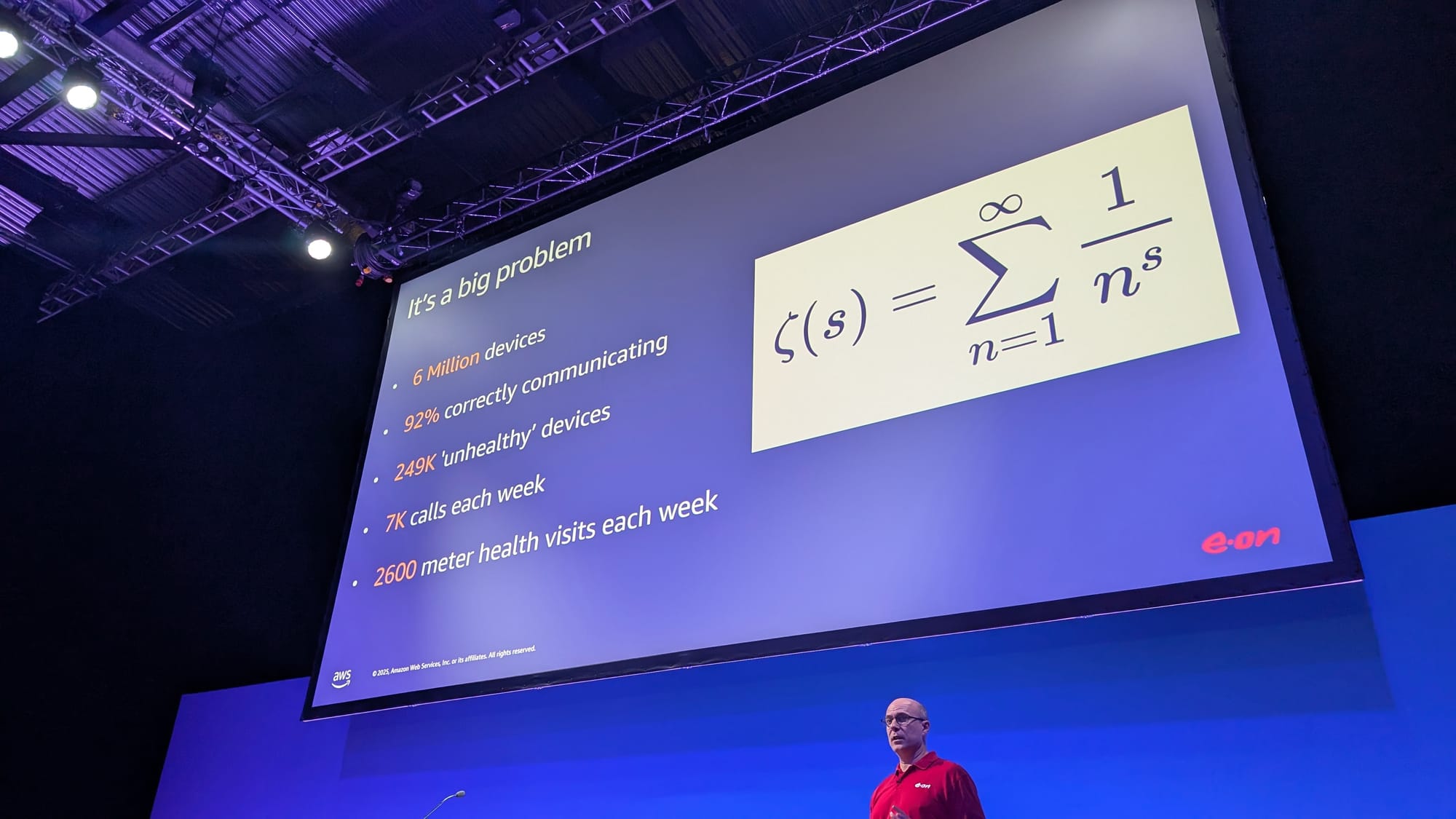 Sam Charlton, product manager at E.ON, stands in front of a large screen