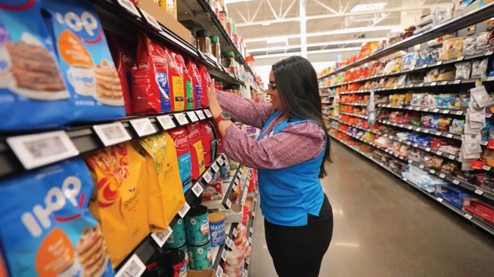 Will this Walmart employee soon be able to do a job that used to require dozens of humans? (Image: Walmart)