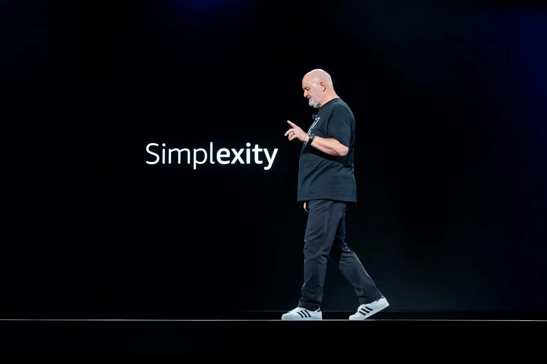 Amazon CTO Werner Vogels speaks at re:Invent 2024 in front of a slide that says "simplexity."
