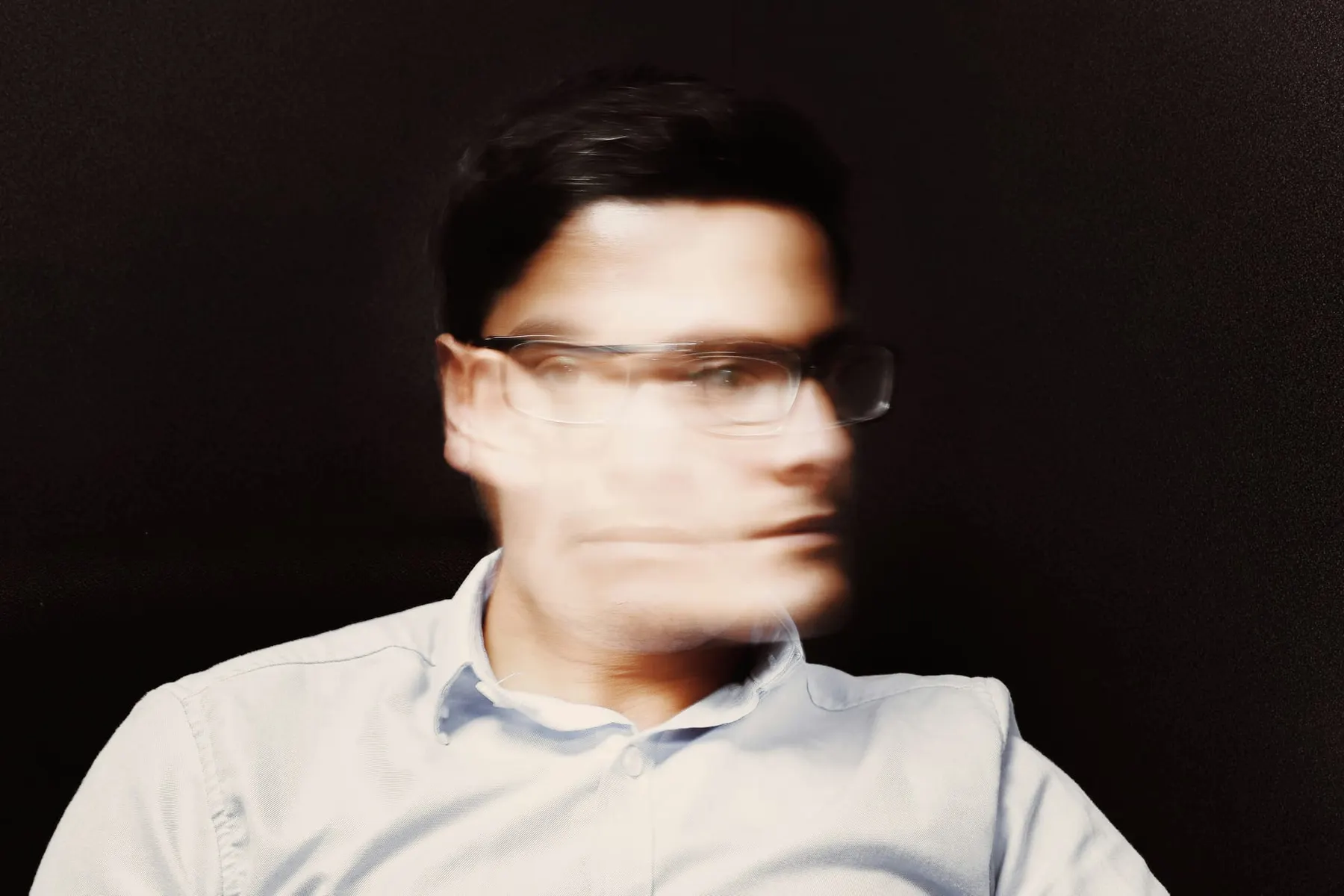 A man with his face blurred as he turns his head. Some fake IT workers have used deepfakes to impersonate real people in interviews