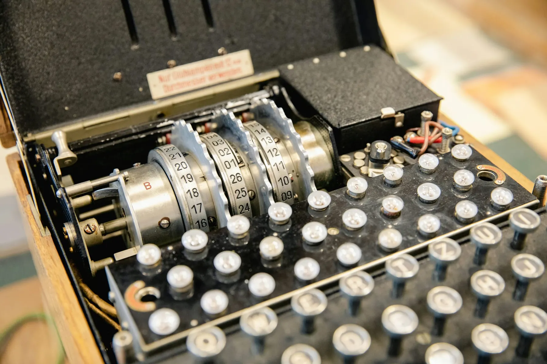 A close up of an enigma encryption machine. Post-quantum cryptography implementation is necessary for the next generation of encryption