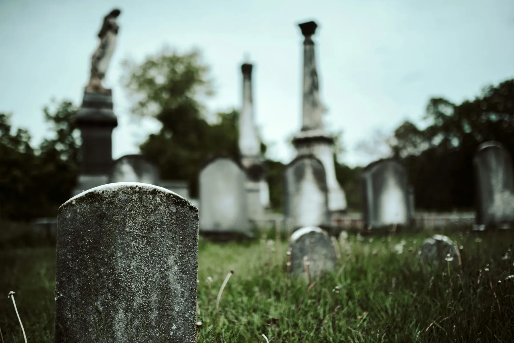 A close of up a gravestone in a graveyard. CISA said a Microsoft Exchange vulnerability posed "grave risk" to systems affected
