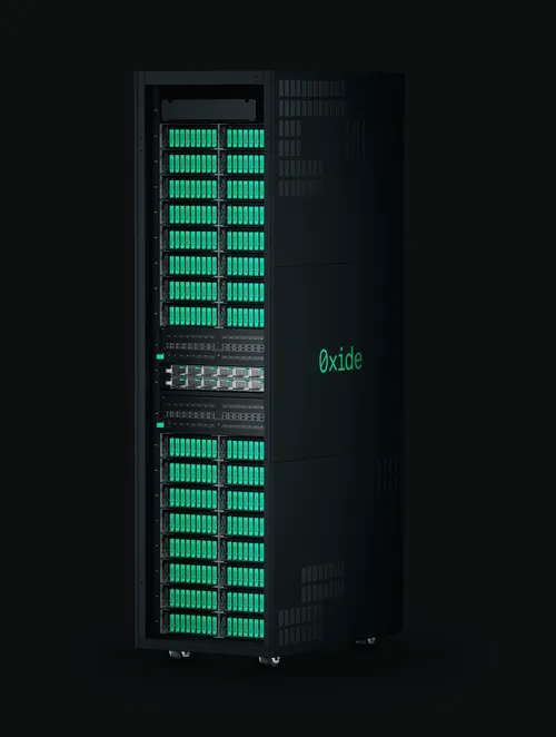 The front view of Oxide's Cloud Computer, a tall black server cabinet filled with green servers called sleds.