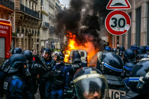 Police group around a vehicle on fire. The EU wants to give Europol decryption technology to break through 6G and post quantum protections.