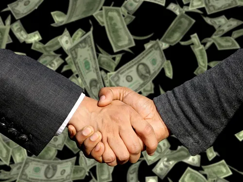 UK chipmaker Dialog Semiconductor agrees to €4.9 billion cash buyout.