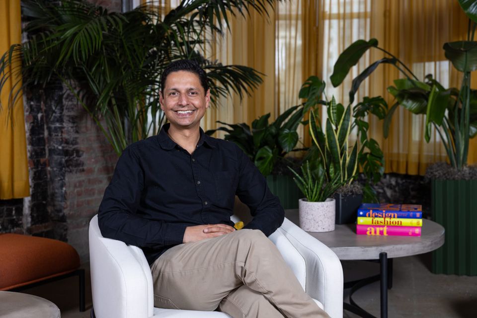 Figma vice president of software engineering Abhi Mathur sits in a chair.