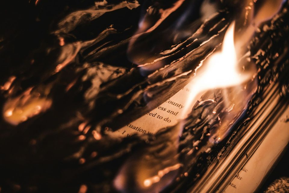 (Photo by Brendan Stephens on Unsplash) A burning book