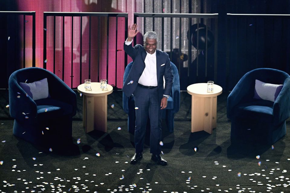 Google Cloud CEO Thomas Kurian waves on stage at Sphere surrounded by confetti
