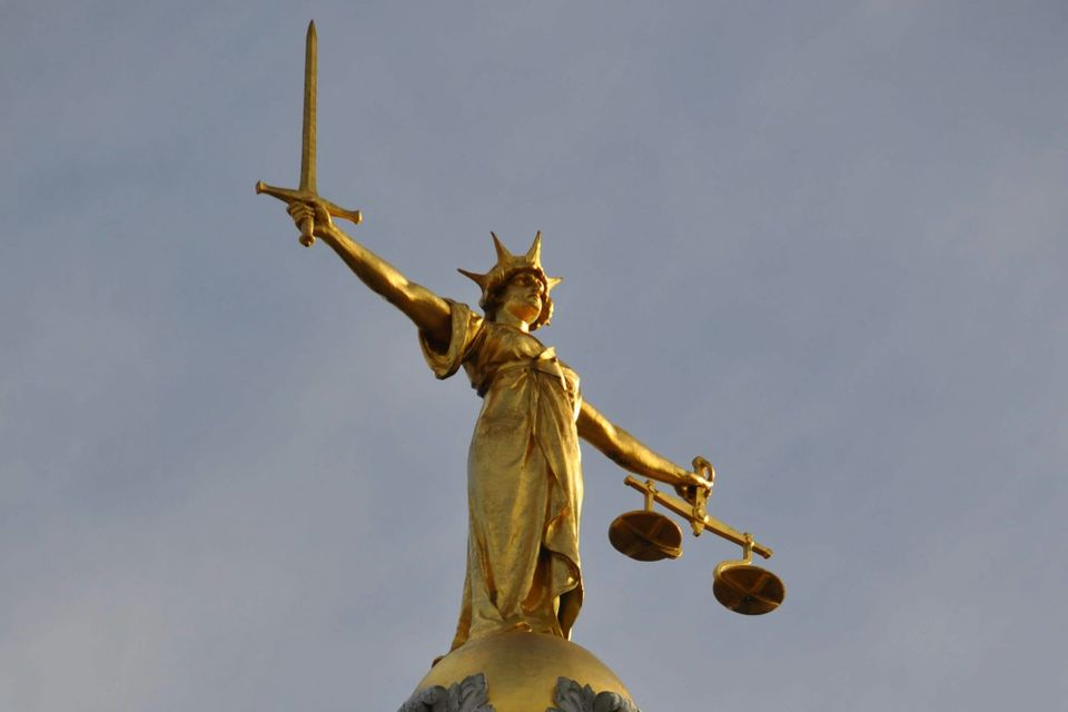 The Lady Justice Statue at the UK crown court, the Ministry of Justice's digital team combined networks for its court, probation and prison systems