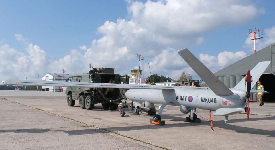 A Watchkeeper surveillance drone sits on tarmac at a military base